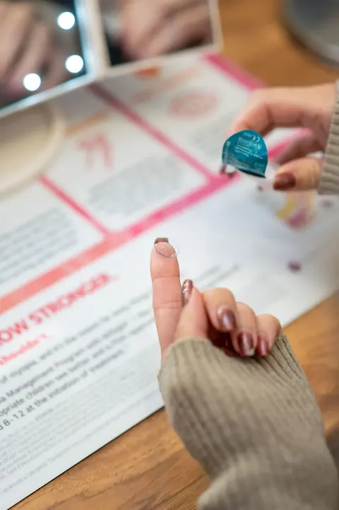 A MiSight myopia-management contact lens on a fingertip