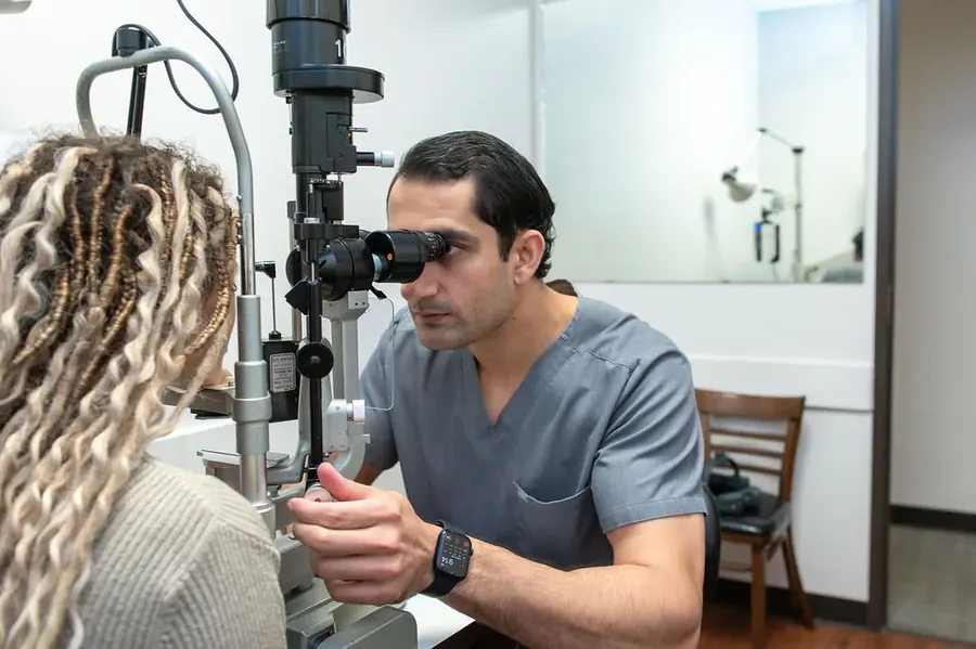 Dr. Waqar performing a slit lamp examination on a patient